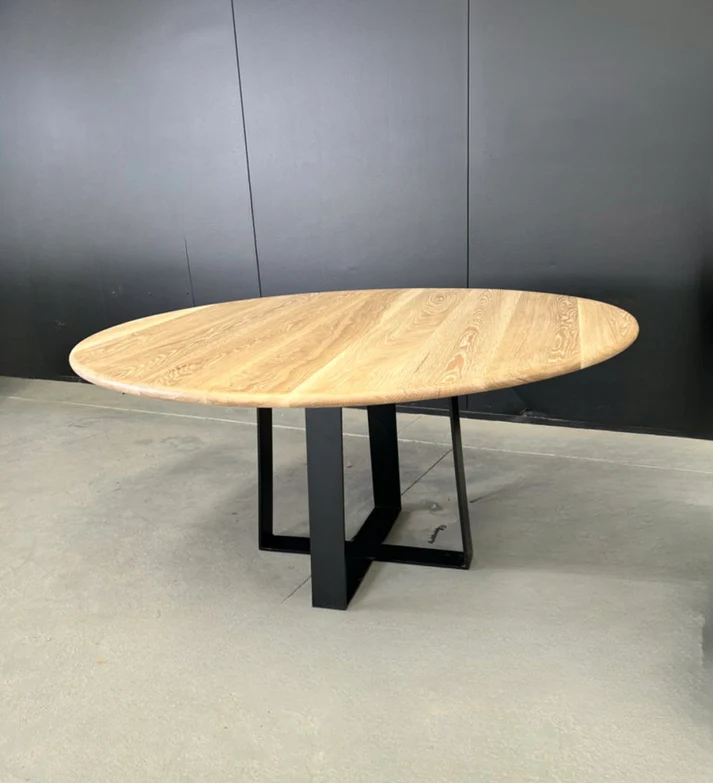 Manly Round Dining Table - A stylish centerpiece by Arranmore Furniture, featuring a sturdy Nikki Steel Black Textured base. Perfect for modern dining spaces seeking industrial sophistication.