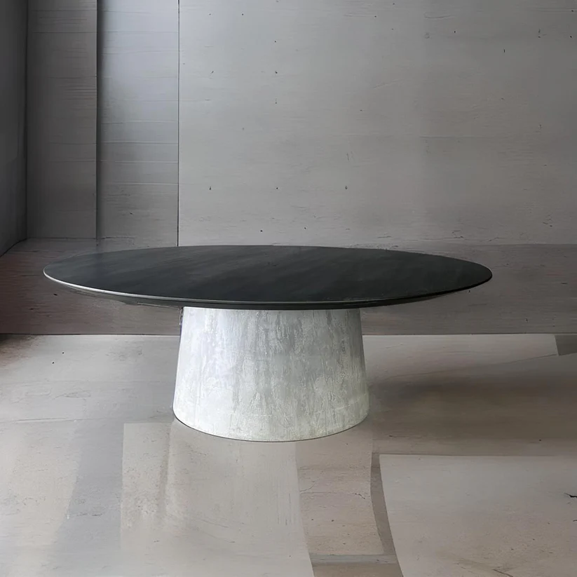 Beton Round Dining Table - A contemporary centerpiece by Arranmore Furniture, showcasing a sleek concrete base for an industrial touch. Perfect for modern dining spaces seeking both style and durability.