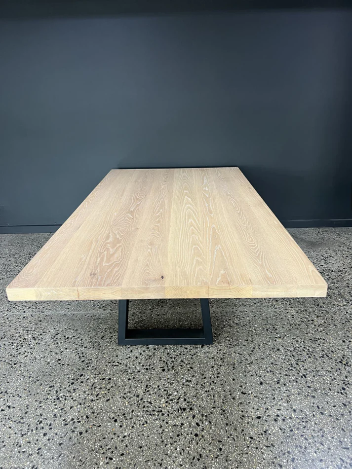 Claremont Dining Table - A versatile centerpiece by Arranmore Furniture, featuring a customizable base in U, Klein, or X Leg design, crafted from timber or steel. Perfect for adding understated elegance to any dining space.