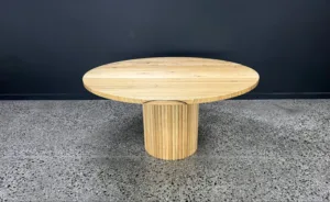 Swanbourne Round Dining Table - A stylish centerpiece by Arranmore Furniture, featuring a Cylinder Ribbed base and Pencil edge. Perfect for modern dining spaces seeking architectural interest and timeless elegance.