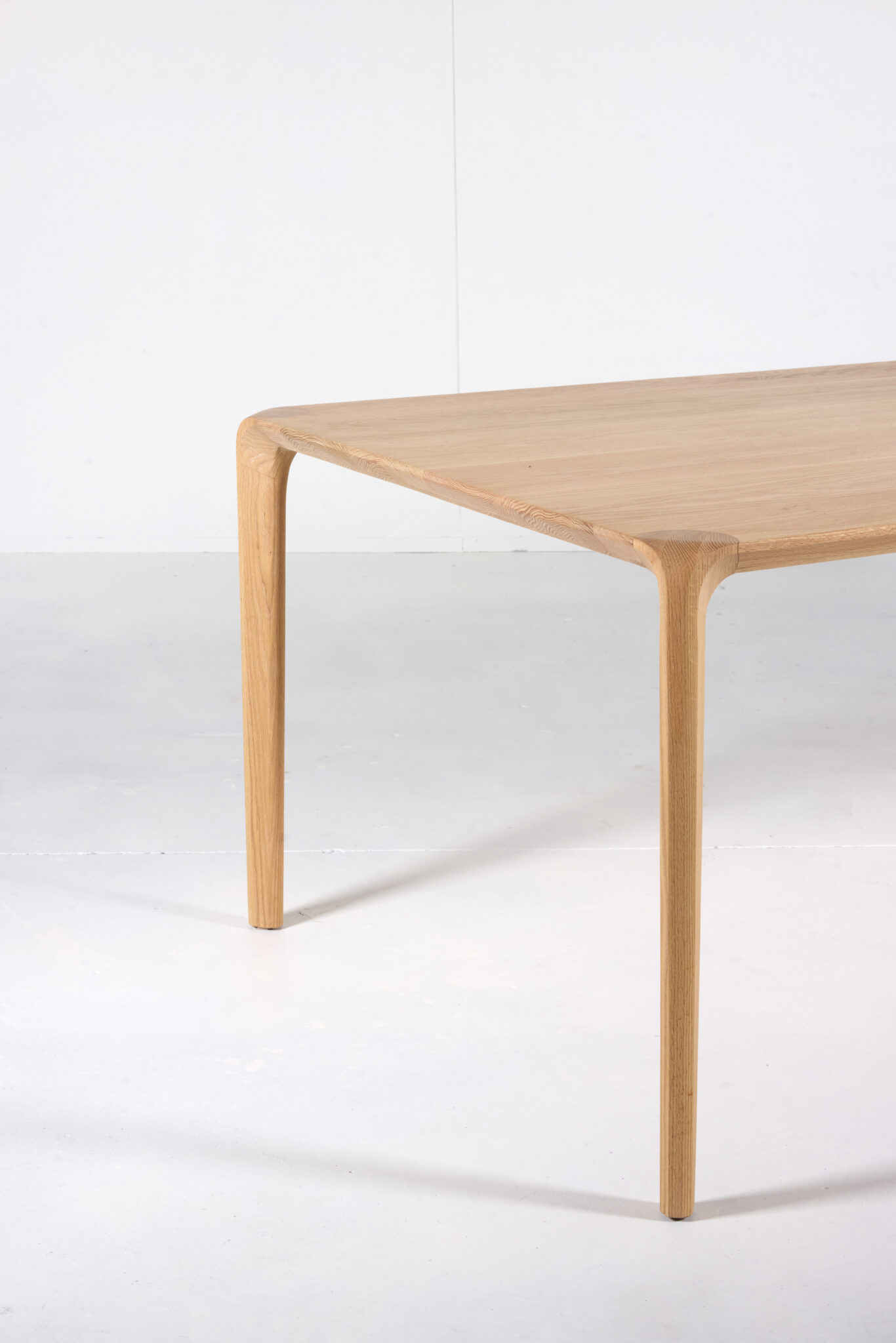 Sara Dining Table - The Sara Leg base not only provides stability but also adds an elegant touch, enhancing the overall aesthetic appeal of the table. Experience sophistication and charm with this beautifully crafted dining table by Arranmore Furniture.