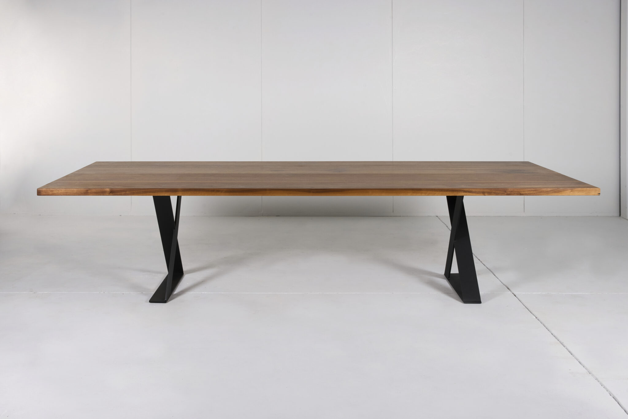 Image of Ballarat Dining Table by Arranmore Furniture showcasing its sleek X Leg design in a modern dining setting