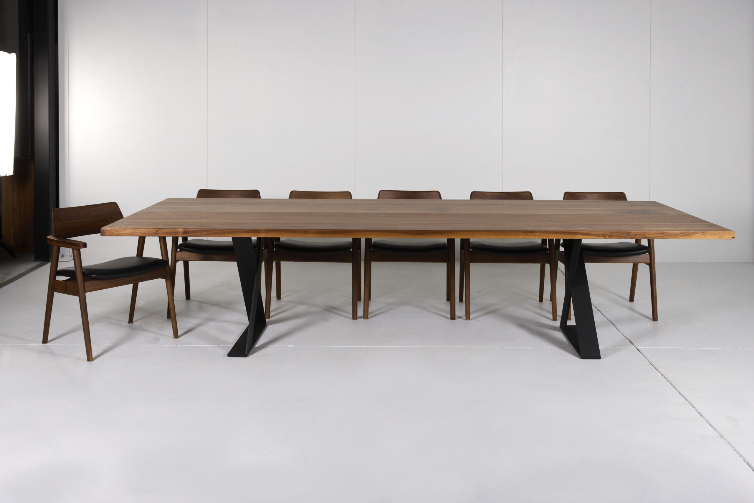 Image of Ballarat Dining Table by Arranmore Furniture, showcasing its sleek X Leg design in a modern dining setting.