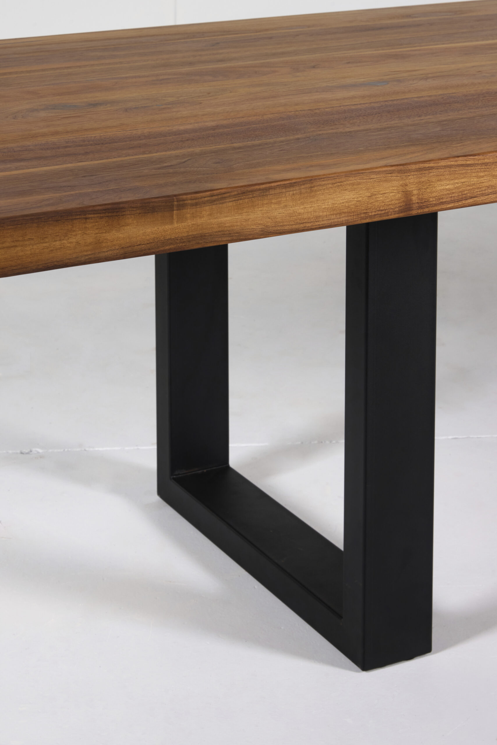 Image of Noosa Dining Table by Arranmore Furniture, showcasing its sleek U or Klein Leg design in a modern dining setting.