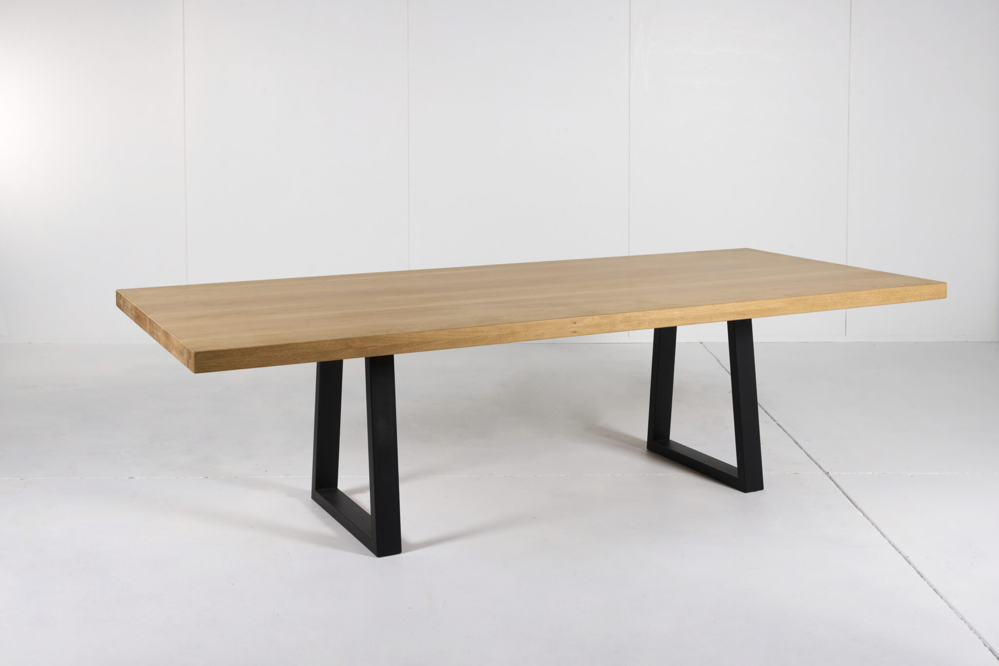 Image of Noosa Dining Table by Arranmore Furniture showcasing its sleek U or Klein Leg design in a modern dining setting