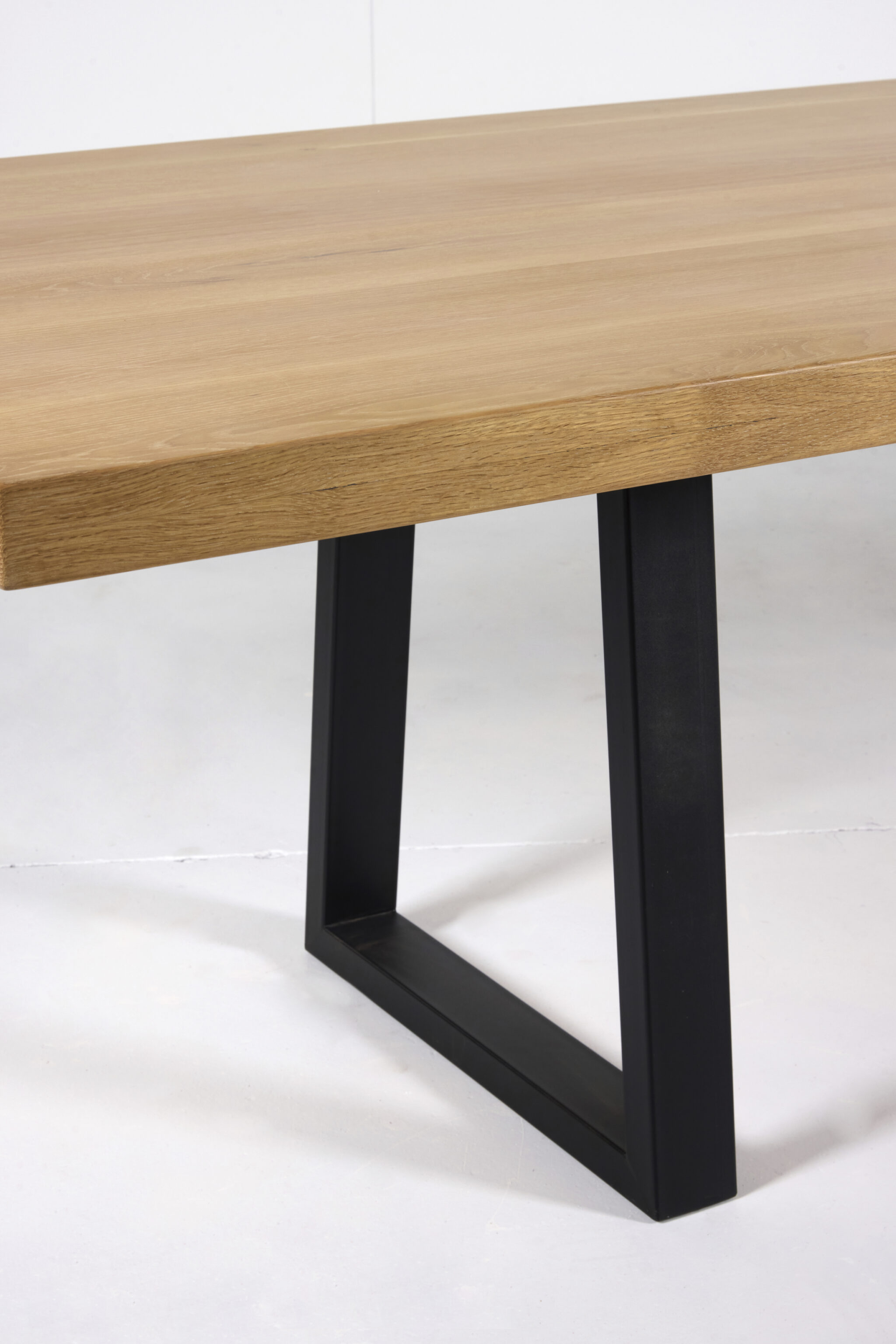 Image of Noosa Dining Table by Arranmore Furniture, showcasing its sleek U or Klein Leg design in a modern dining setting.