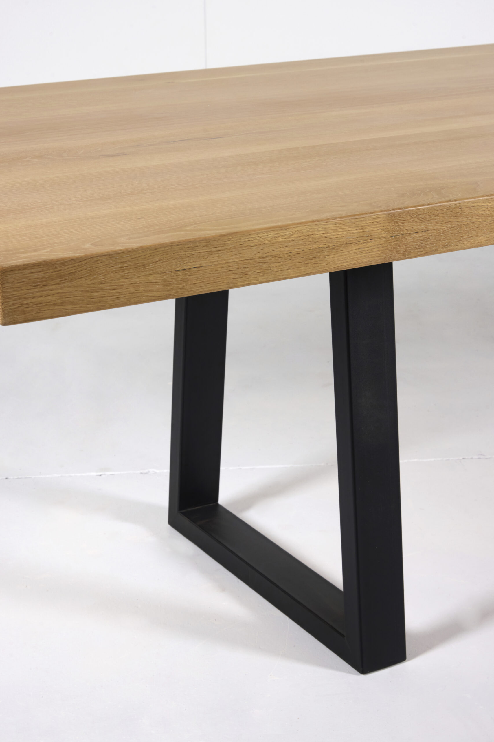 Image of Noosa Dining Table by Arranmore Furniture, showcasing its sleek U or Klein Leg design in a modern dining setting.