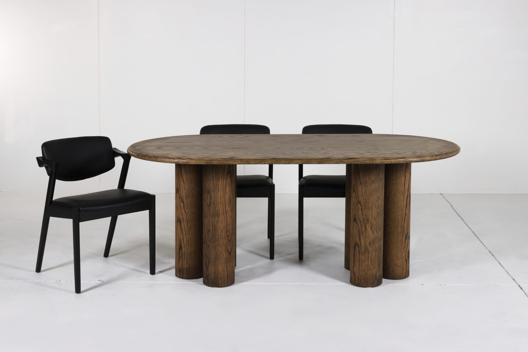 Pillar Dining Table crafted from premium timber with a sleek pencil edge and sturdy pillar base.