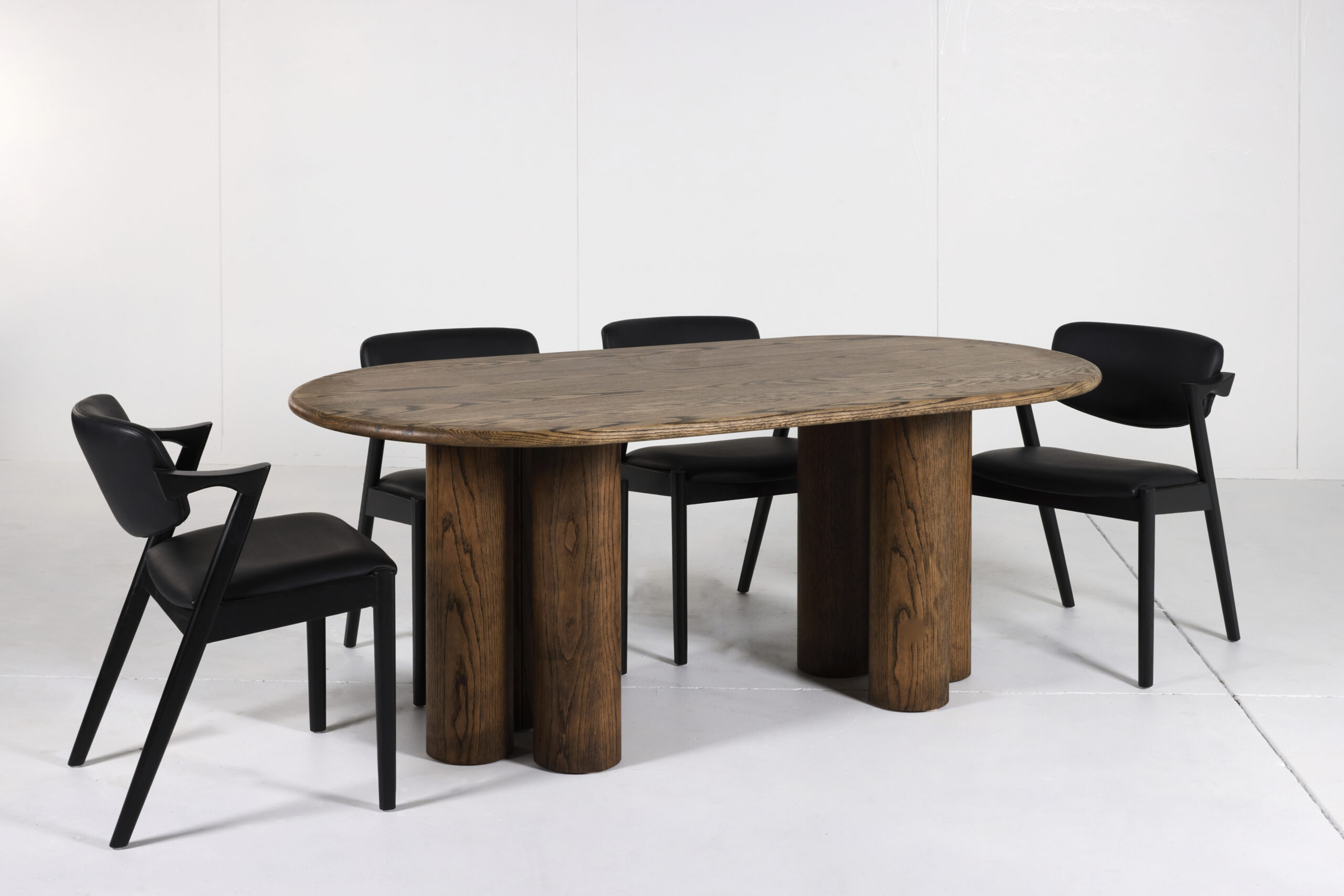 Pillar Dining Table crafted from premium timber with a sleek pencil edge and sturdy pillar base.