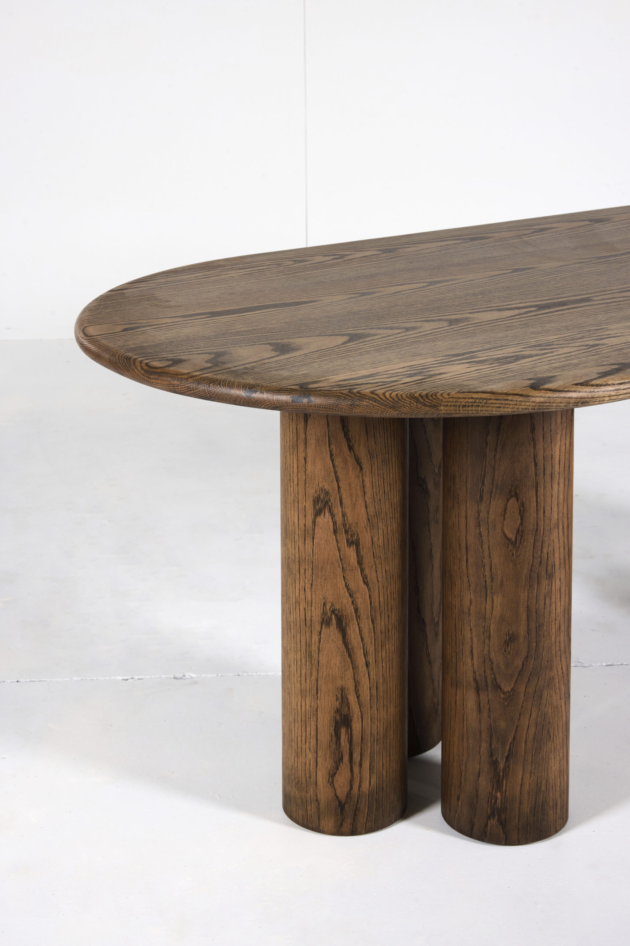 Pillar Dining Table crafted from premium timber with a sleek pencil edge and sturdy pillar base.