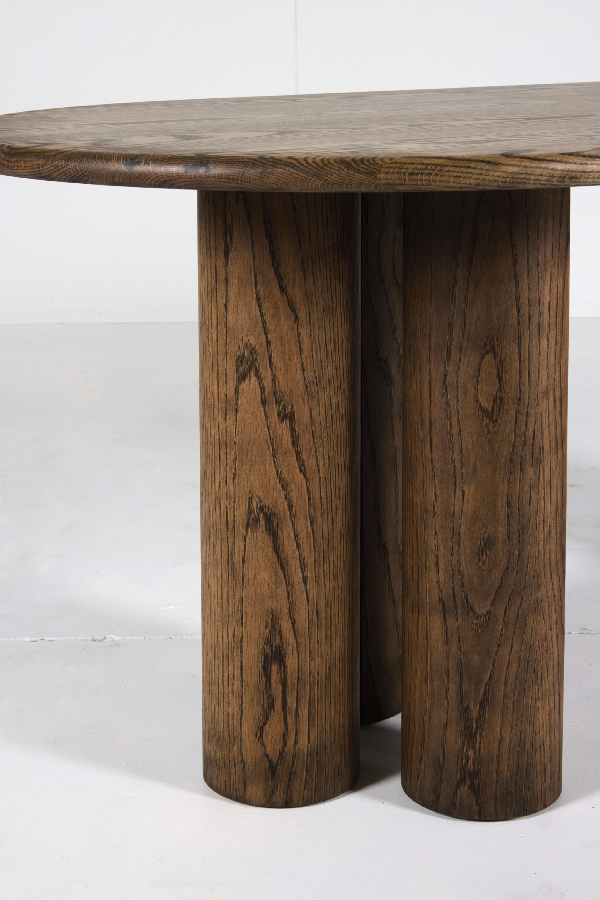 Pillar Dining Table crafted from premium timber with a sleek pencil edge and sturdy pillar base.