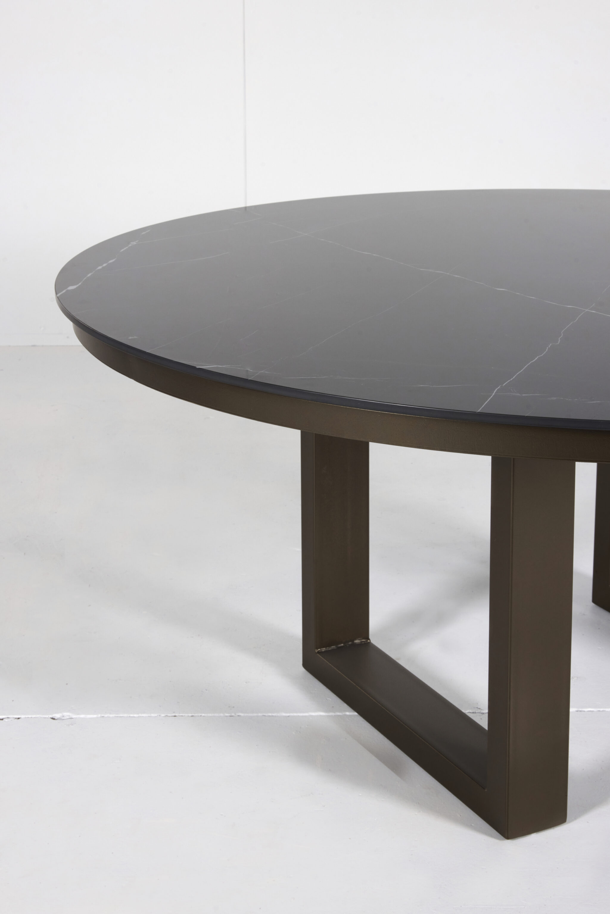 Porcelain Outdoor Round Dining Table with marble top and customizable timber or steel base by Arranmore Furniture.